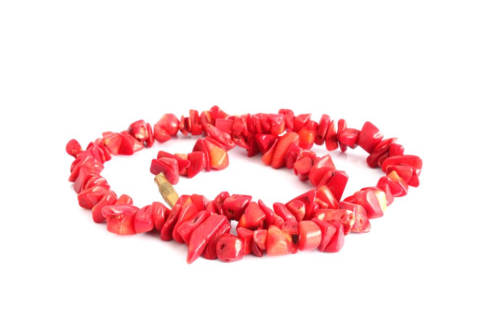 coral beads over white