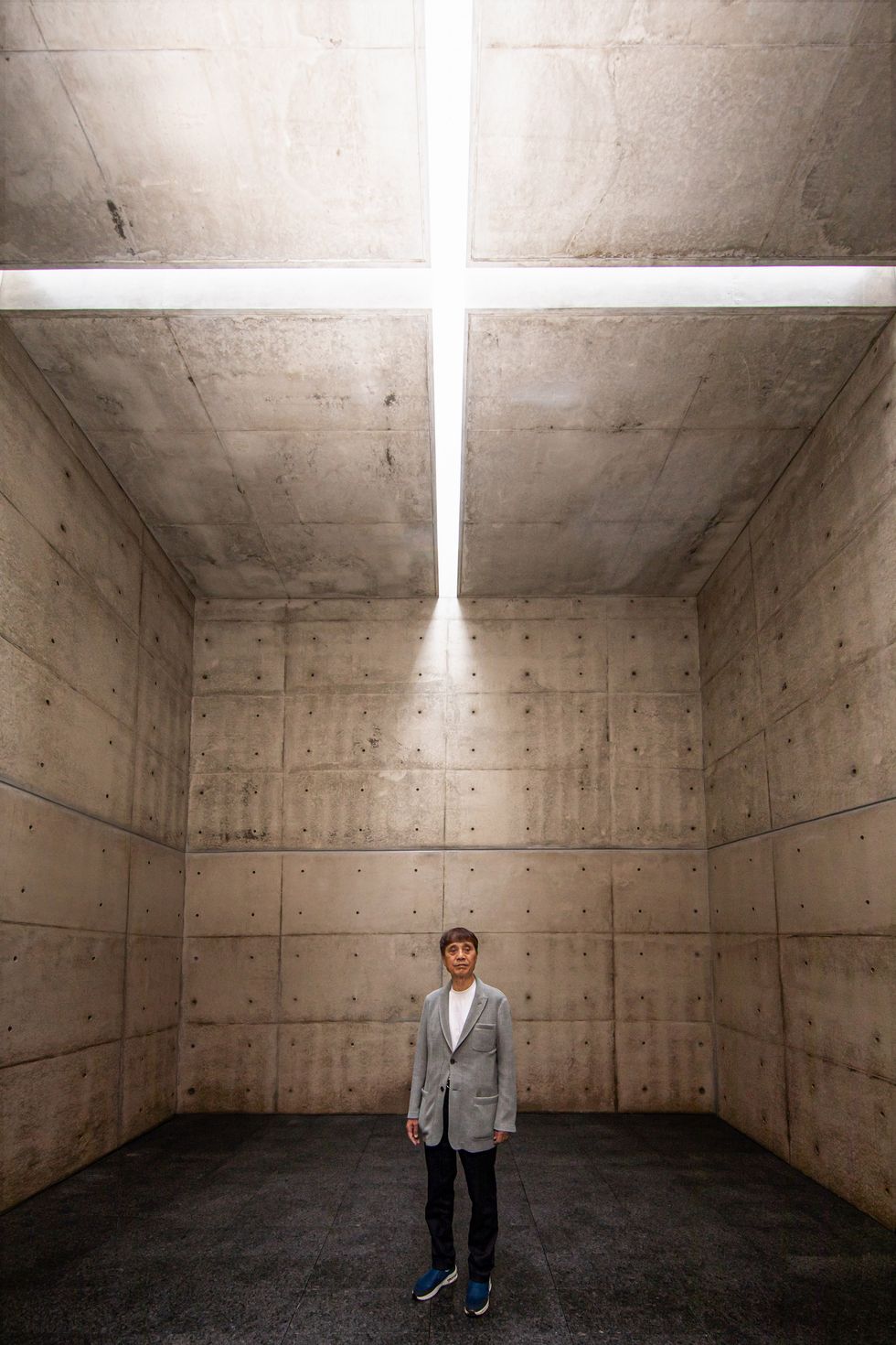 architect inside a concrete chapel