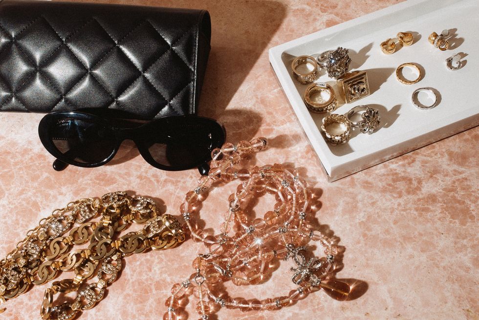 a pair of sunglasses and a box of jewelry
