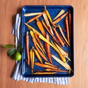 coriandermaple glazed carrots in blue pan