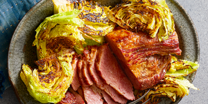 sliced corned beef and grilled cabbage on a gray plate