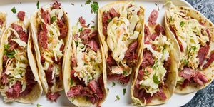 corned beef tacos with green cabbage carrots sauerkraut and beer