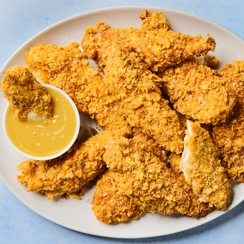 cornflake crusted chicken tenders dipped in honey mustard