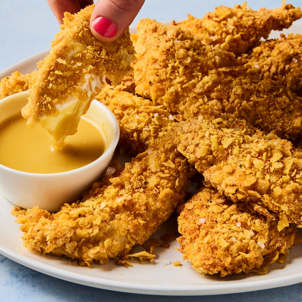 cornflake crusted chicken tenders dipped in honey mustard