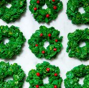 green cornflake marshmallow treat wreaths with red candy holly berries