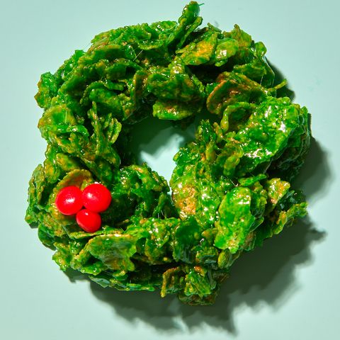 green cornflake marshmallow treat wreaths with red candy holly berries