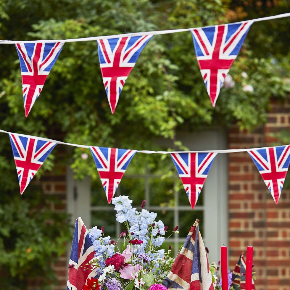 king charles iii coronation decorating outdoor tablescaping country living union jack decor table setting accessories