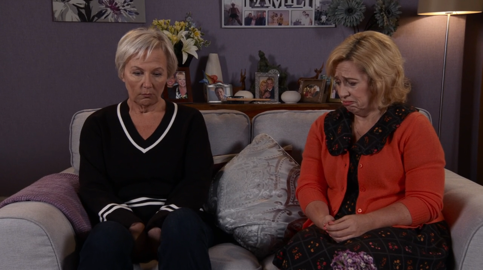 julie carp and eileen grimshaw sat on a sofa together