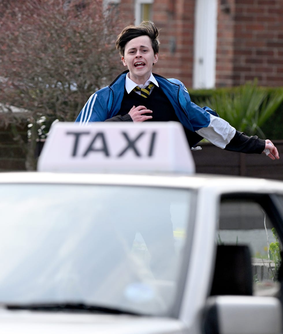 a young kit running towards a leaving taxi as coronation street film flashback scenes for bernie winter