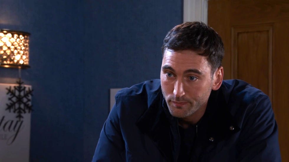 coronation street, kit green in december 2024, in a dark blue jacket