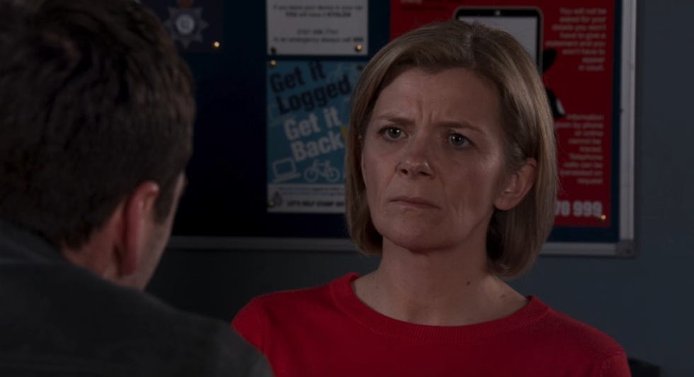 coronation street's leanne looks serious as she is interviewed in the police station