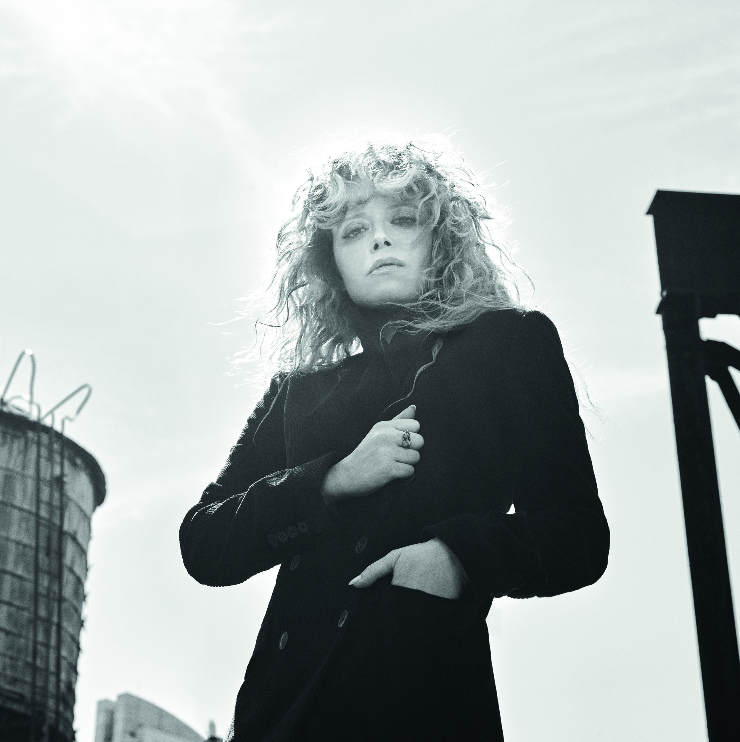 It would be infuriating that Natasha Lyonne hasn’t fronted a major fashion campaign yet, except the one she finally landed is just so good. As the new face of COS, the actress / director / producer stares down a camera lensed by Mario Sorrenti and styled by Camilla Nickerson. In the images, Lyonne wears a black peacoat and fishnets, framed by a New York rooftop and not the least bit concerned that she’s got no pants. As the kids say: <i>She eats.</i>
<br><br>
As I imagine, she also actually <i>eats</i>, and drinks, and smokes, and creates, and has a whole life outside of this fashion racket, which—Lyonne assures me—is the whole point. “I think COS is great because the quality is very nice; very nice, but also, you can go to a store and get it. You can wear it even if you don’t have a stylist, or a lot of time to get yourself together. It’s like a shortcut to getting it right.”
<br><br>
Lyonne calls me en route to work—she’s shooting <i>Poker Face</i>, the TV series from <i>Knives Out</i>'s Rian Johnson—and since she’s way more interesting than I am, I’m gonna get out your way and just tell you what she said.