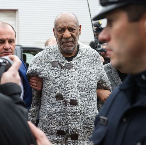 cosby in a grey sweater being arrested