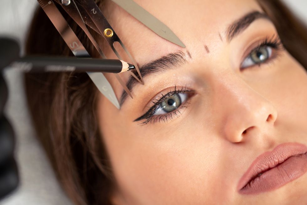 Cosmetician preparing to make a legit appearance of naturally full brows