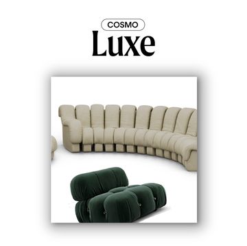 a white couch with green pillows