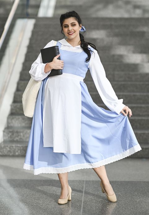 woman dressed as belle from beauty and the beast