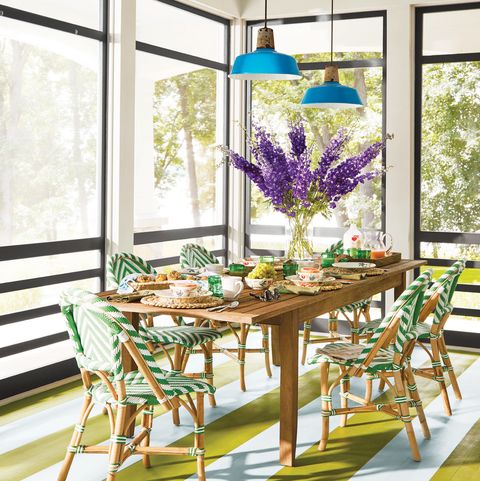 colorful screened in porch with dining table