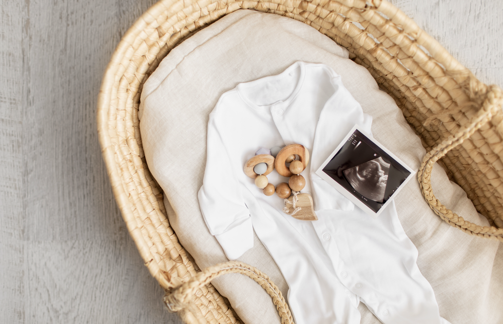 a baby scan photo in a basket