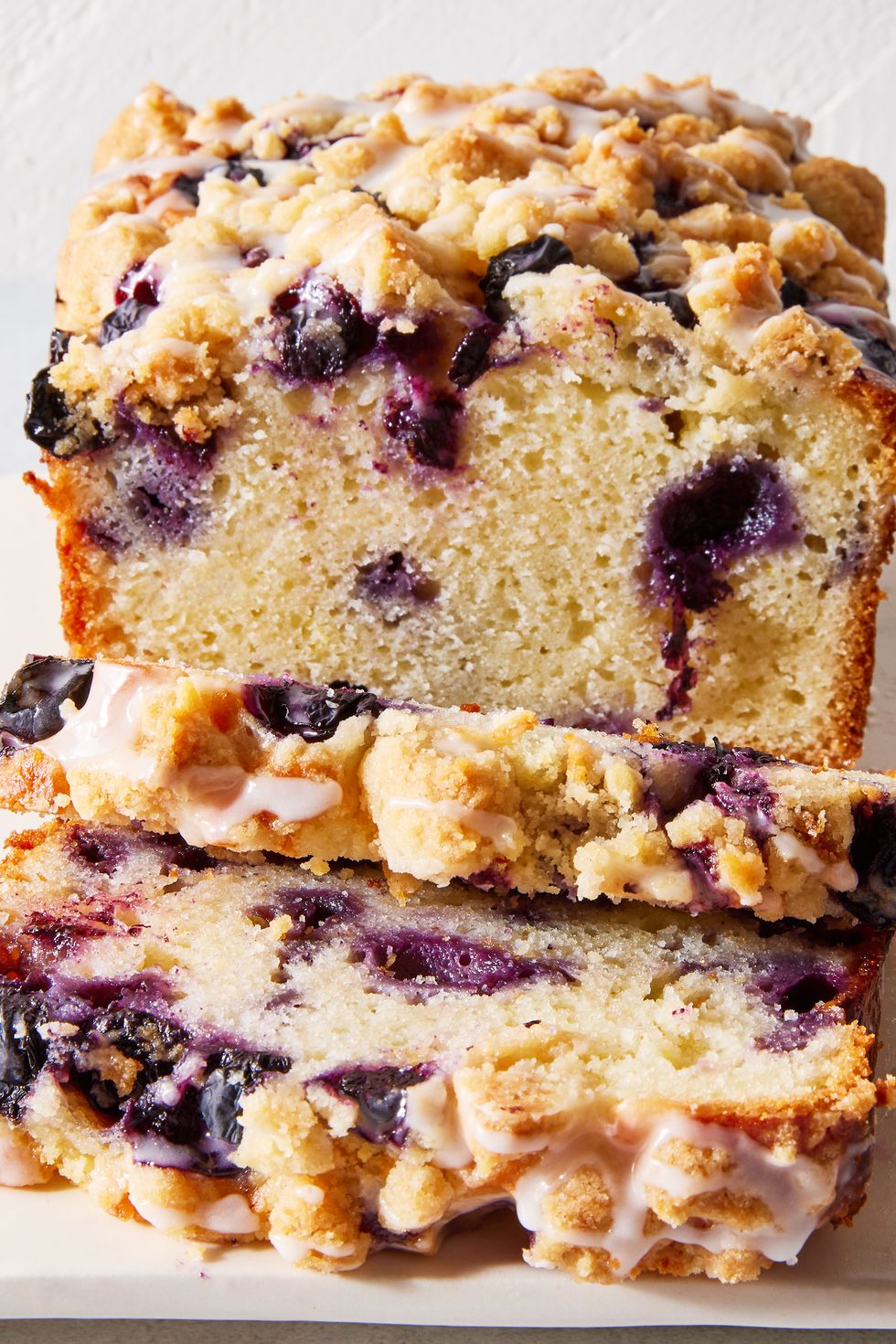 copycat costco lemon blueberry pound cake with a lemon glaze and crumble topping