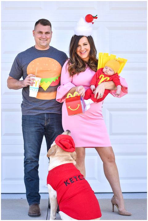 woman dressed up as milkshake man dressed in burger t shirt baby dressed as mcdonalds fries and dog dressed up as ketchup bottle