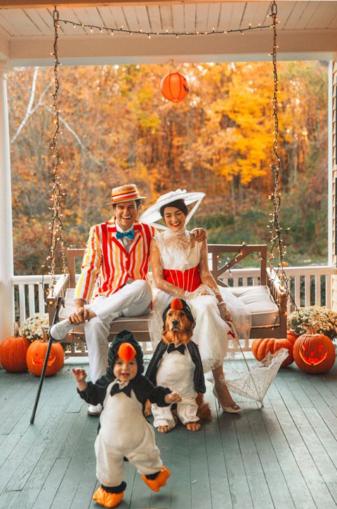 family dressed in mary poppins costume with baby and dog as penguins