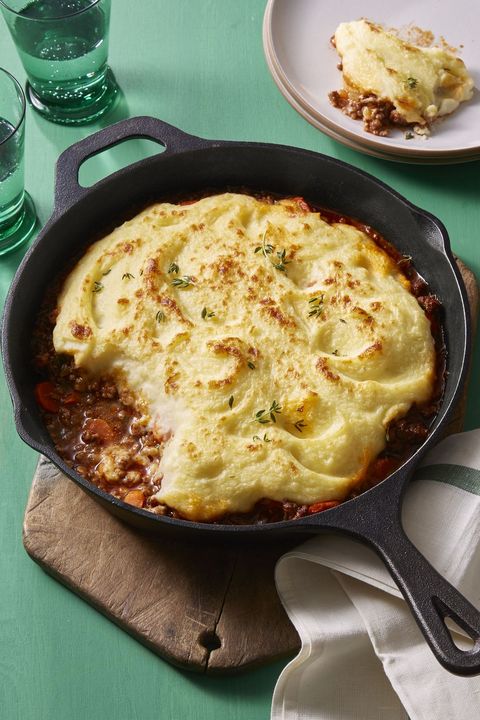cottage pie with mashed potatoes on top, in a cast iron skillet
