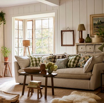 a country style living room with a couch and a table