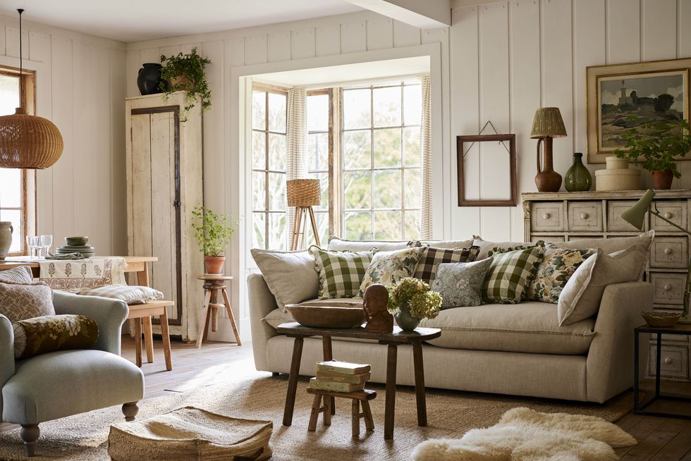 a country style living room with a couch and a table