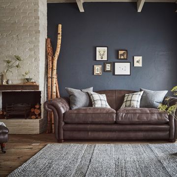 brown leather sofa in a country inspired home
