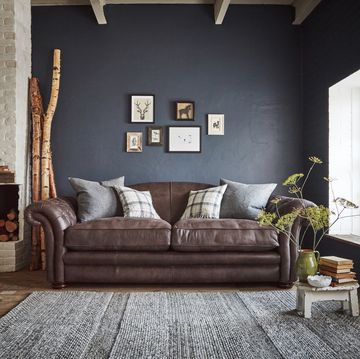 brown leather sofa in a country inspired home