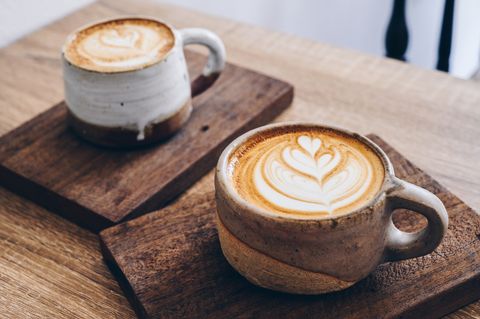 couple cup of latte coffee on wooden table