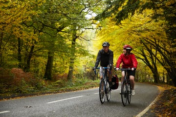 couple cycling along country road