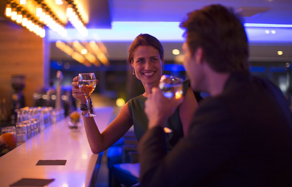 Couple drinking wine in a hotel bar