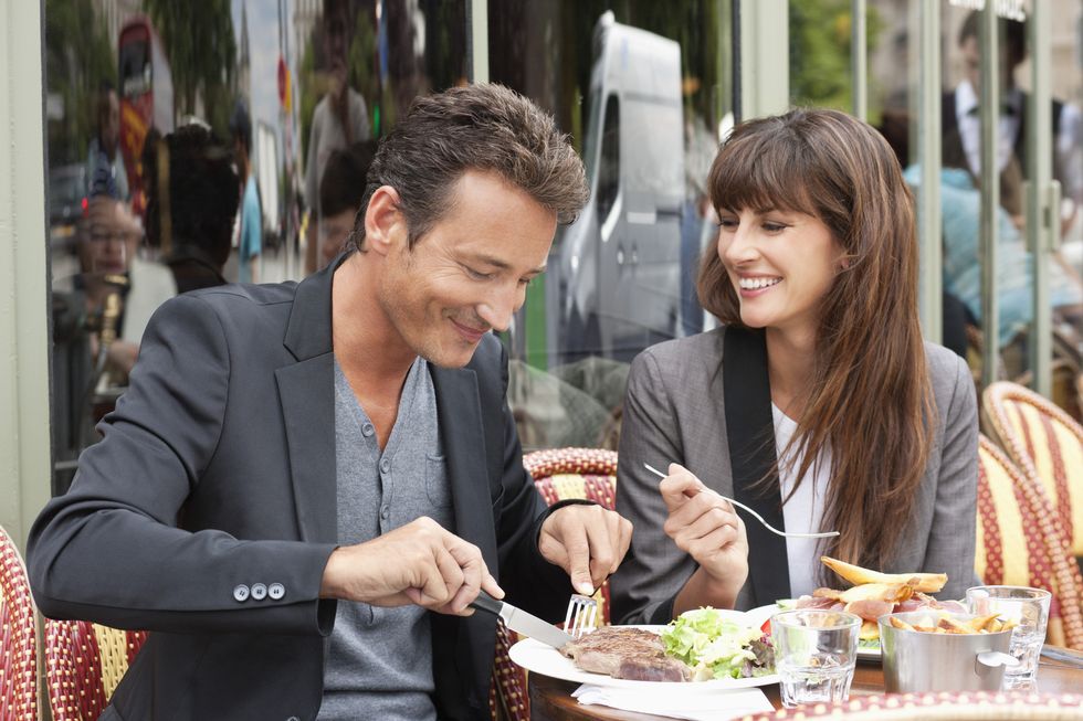 Couple enjoying lunch at a restaurant, Paris, Ile-de-France, France