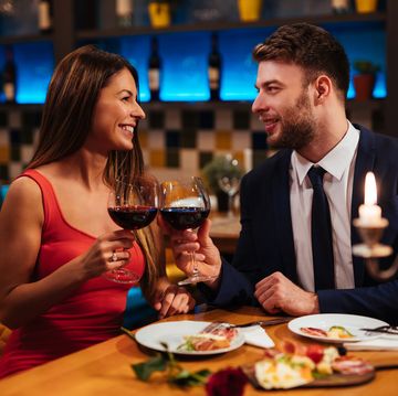 couple enjoying red wine on valentine's day