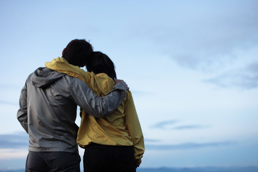 couple hugging at the mountain