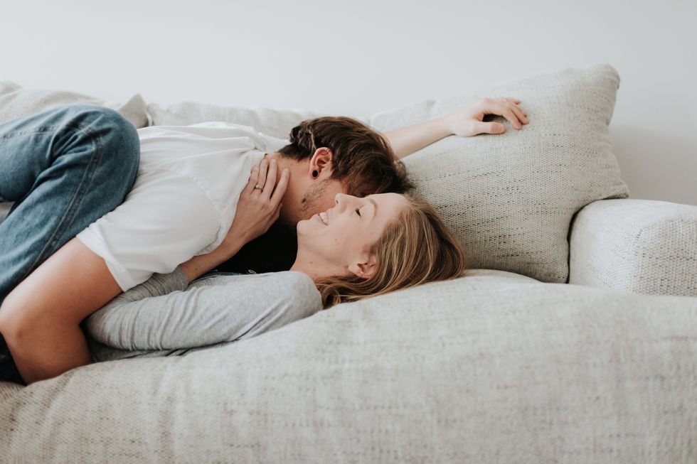 couple hugging on sofa
