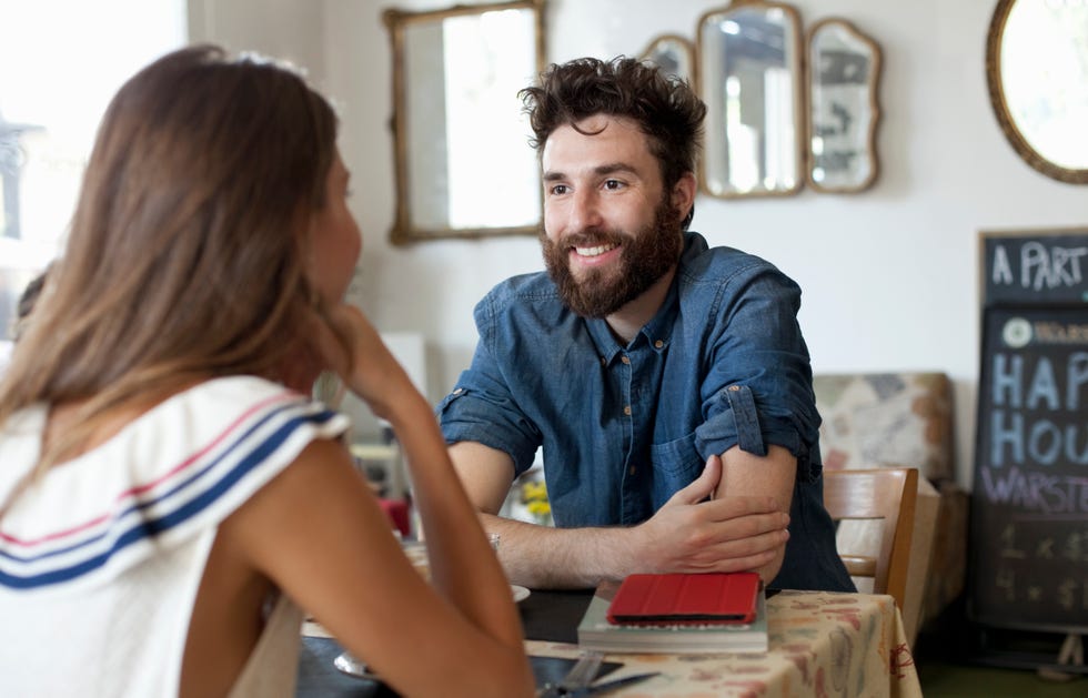 couple in a café, talking to each other