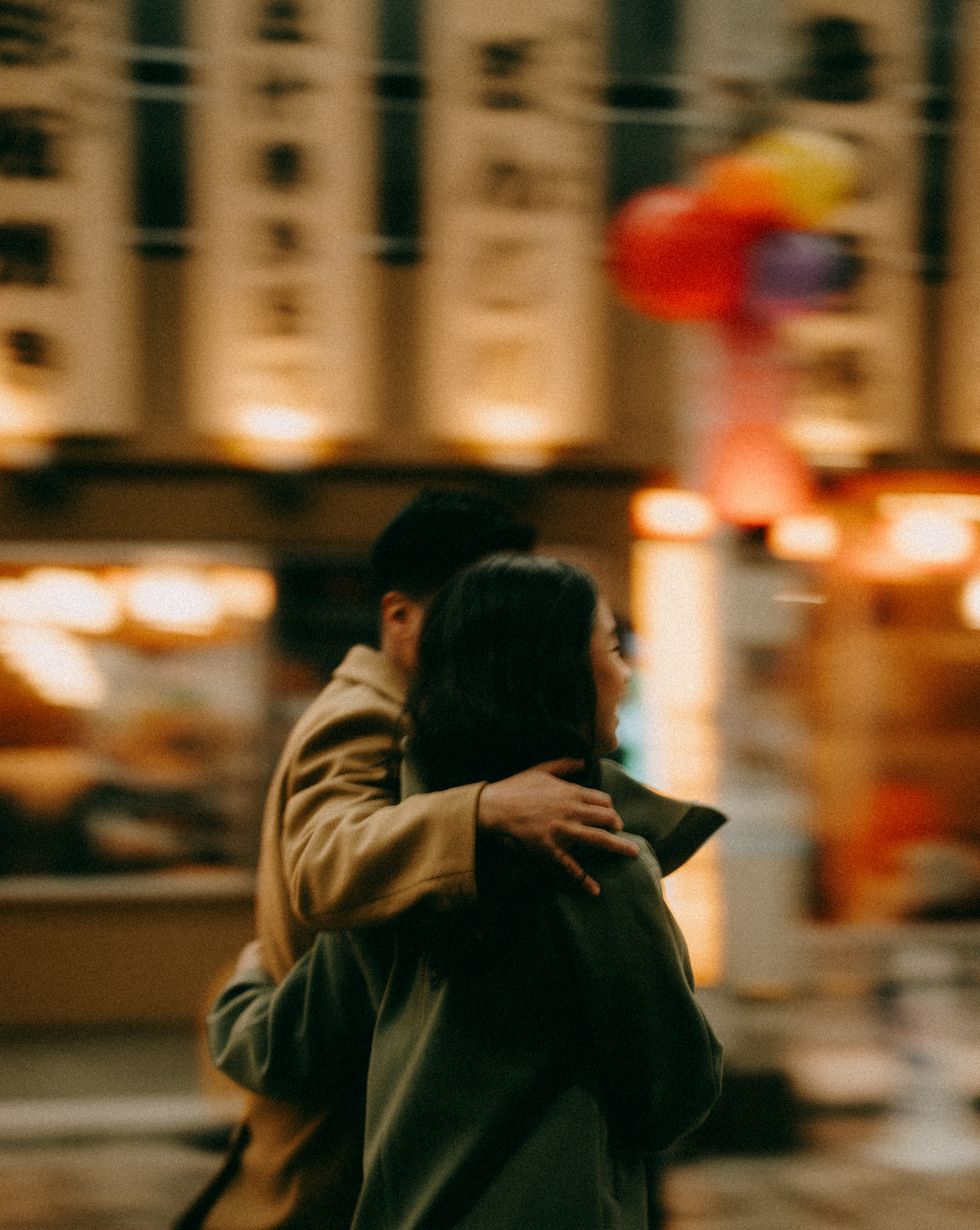 couple in blurred motion at night in tokyo in winter