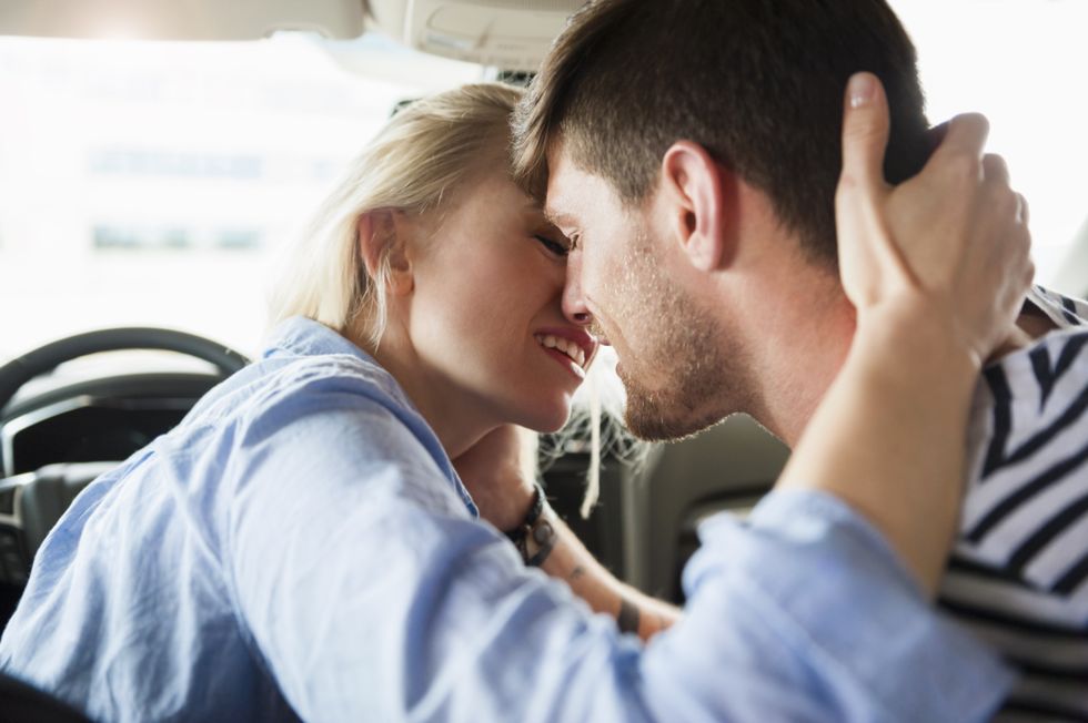couple in love kissing in a car