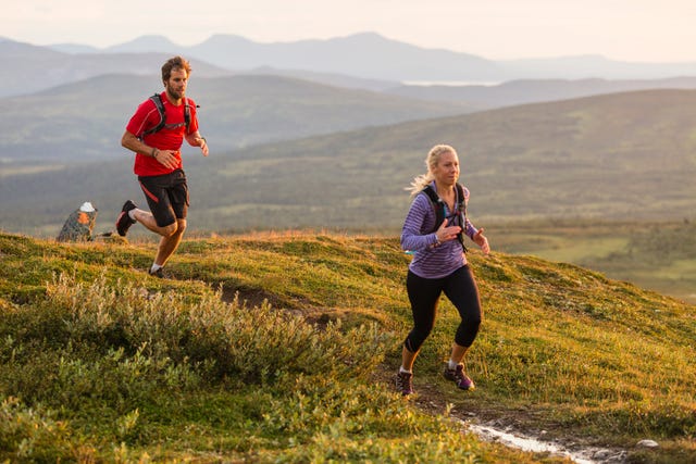Couple jogging in mountains