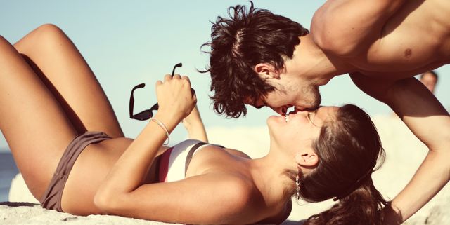 Couple kissing at beach, Italy