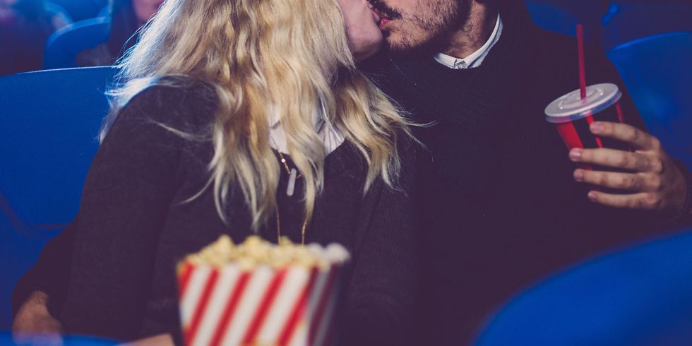 Couple kissing in the cinema