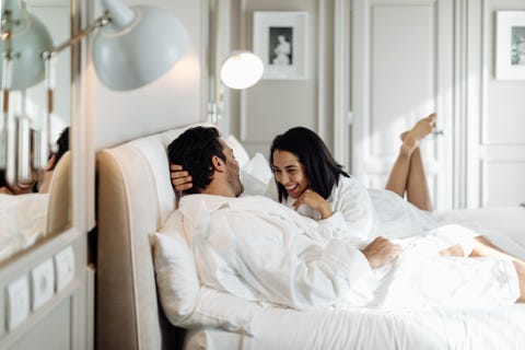 couple laughing and relaxing in suite