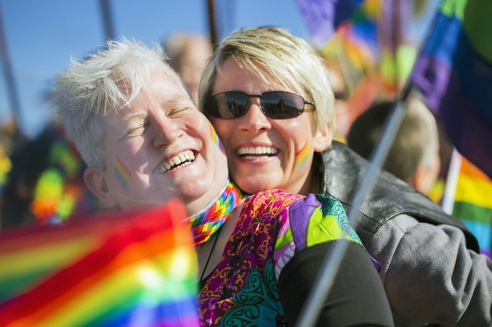 couple laughing in gay parade
