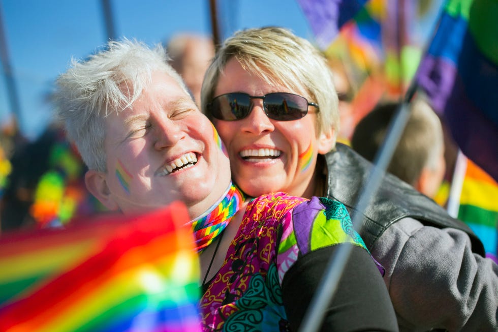 Couple laughing in gay parade couple laughing in gay parade