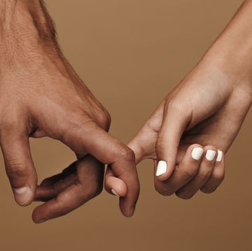 couple linking index fingers