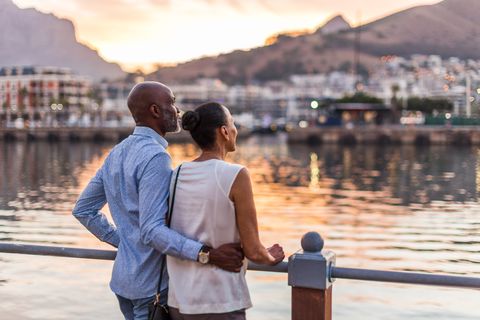 couple looking at sunset at cape town waterfront