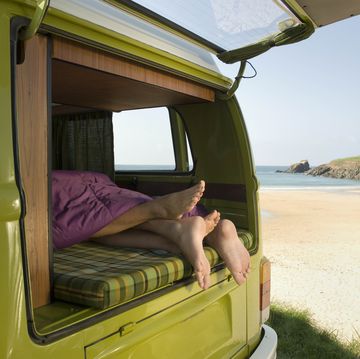 couple lying in camper van