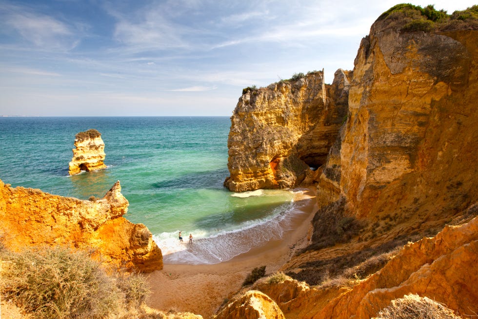 Couple on most beautiful famous beach in Portugal.